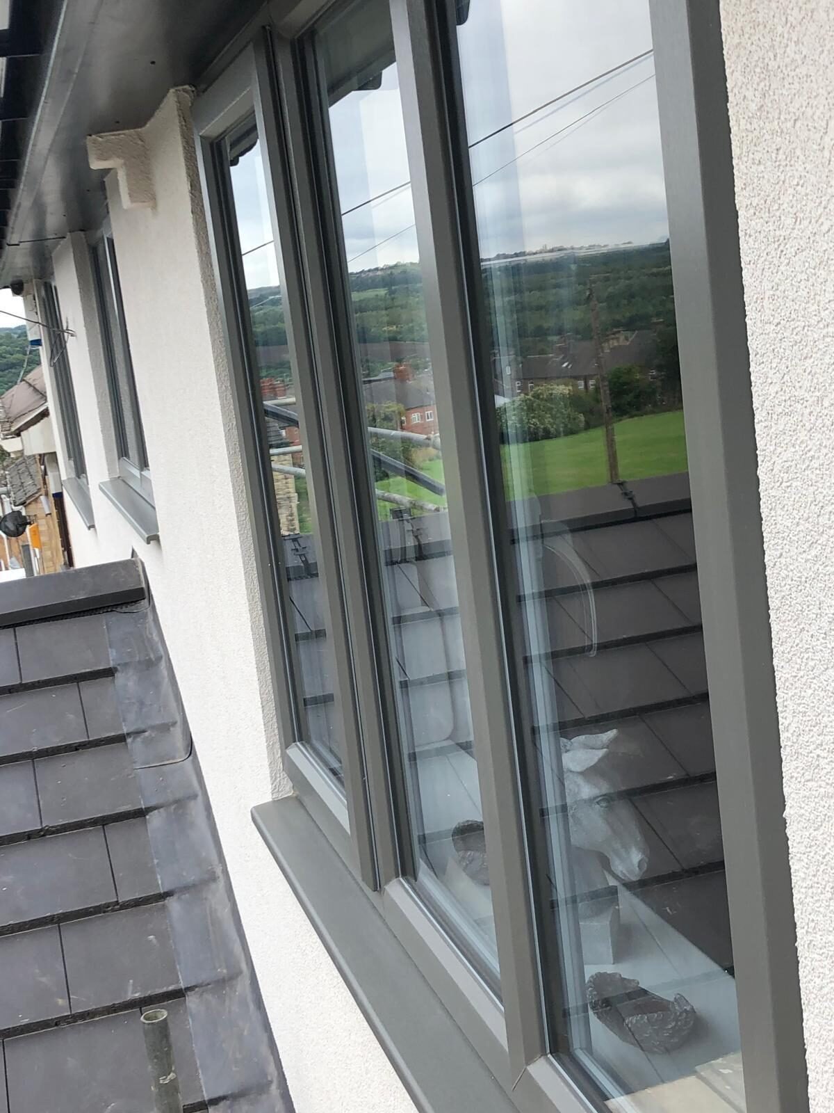 Close detail of grey silicone render around a window